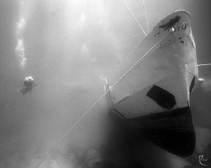   Patrol Boat 119 took this shot 13 minutes after new shipwreck touched oceans ground. Lots dirt dust clouds....the ships stern was totally covered sand cloud time. Ambient light converted BW. ground cloudsthe clouds time B/W. B/W W.  